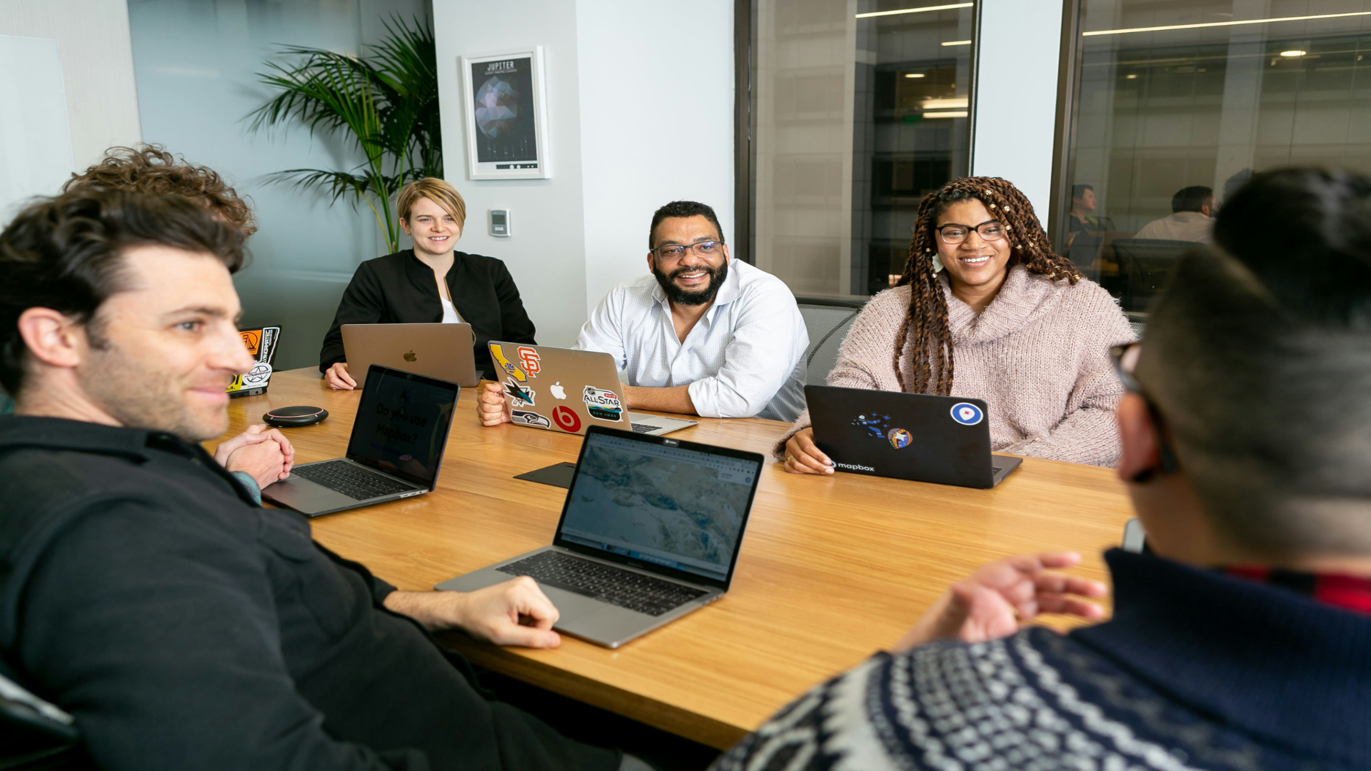 people in an office having a boardroom meeting